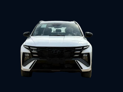 White SUV on a dirt road with a blurred background