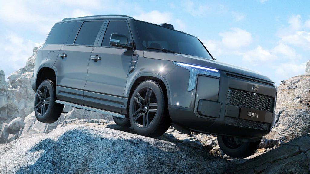 SUV on rocky terrain with a clear sky